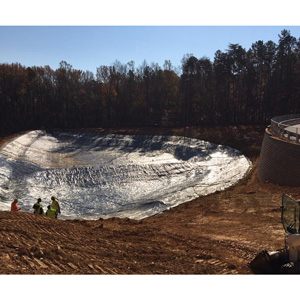 30-mil PVC liner installation in a storm water collection.