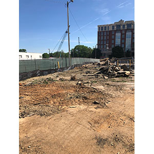 Curb demolition for silt fence installation.