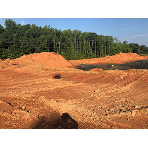 Pond closure with soil cap.